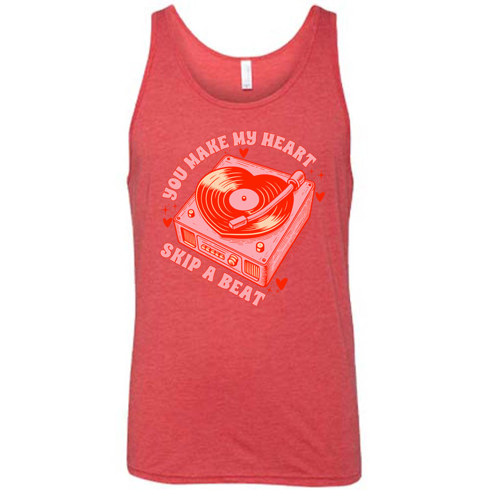 red unisex tank with the words "you make my heart skip a beat" on it, with the graphics of a record player, with a record shaped like a heart, with a little hearts and stars around each corner of the player