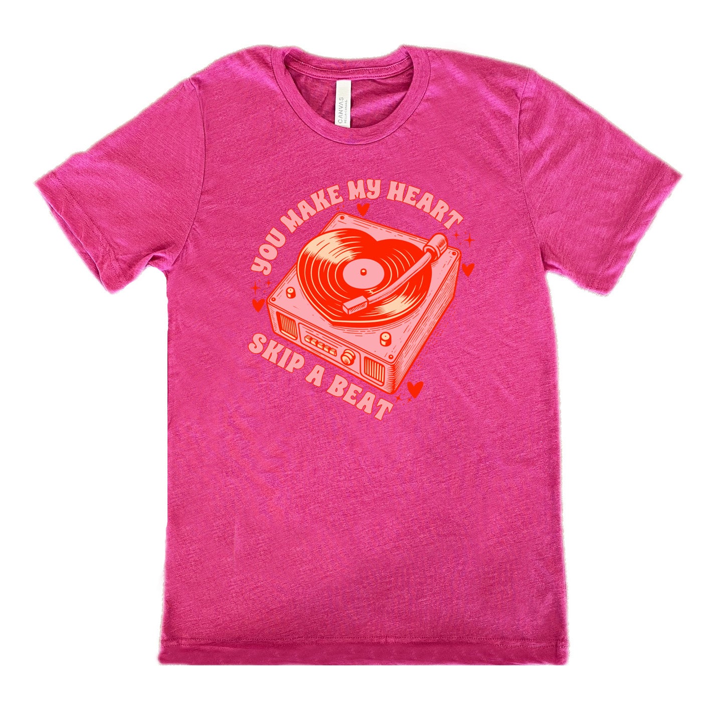 berry unisex tee with the words "you make my heart skip a beat" on it, with the graphics of a record player, with a record shaped like a heart, with a little hearts and stars around each corner of the player