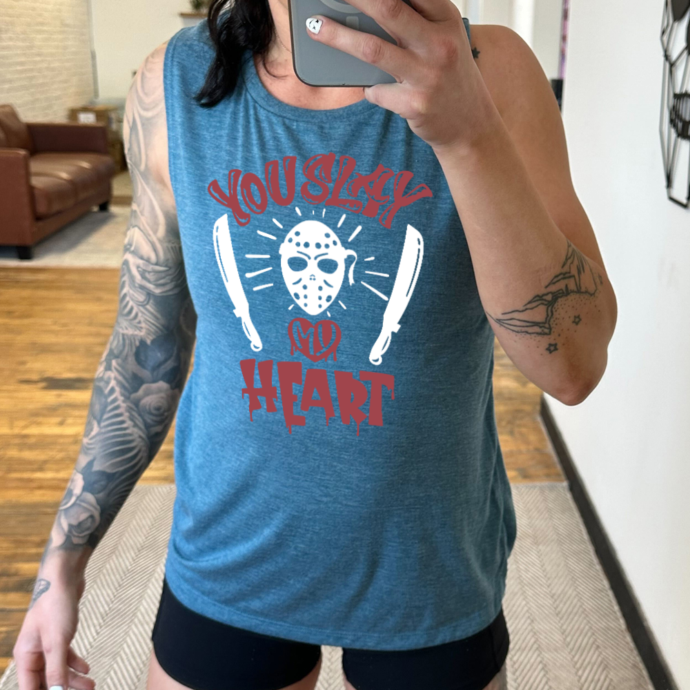 deep teal muscle tank with the words "you slay my heart" on it in horror movie style writing, with "my' being in a dripping heart, and graphics of the Jason mask from Friday the 13th and two machetes 