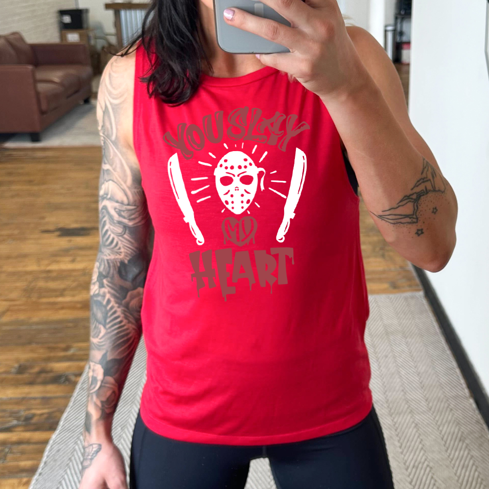 red muscle tank with the words "you slay my heart" on it in horror movie style writing, with "my' being in a dripping heart, and graphics of the Jason mask from Friday the 13th and two machetes 