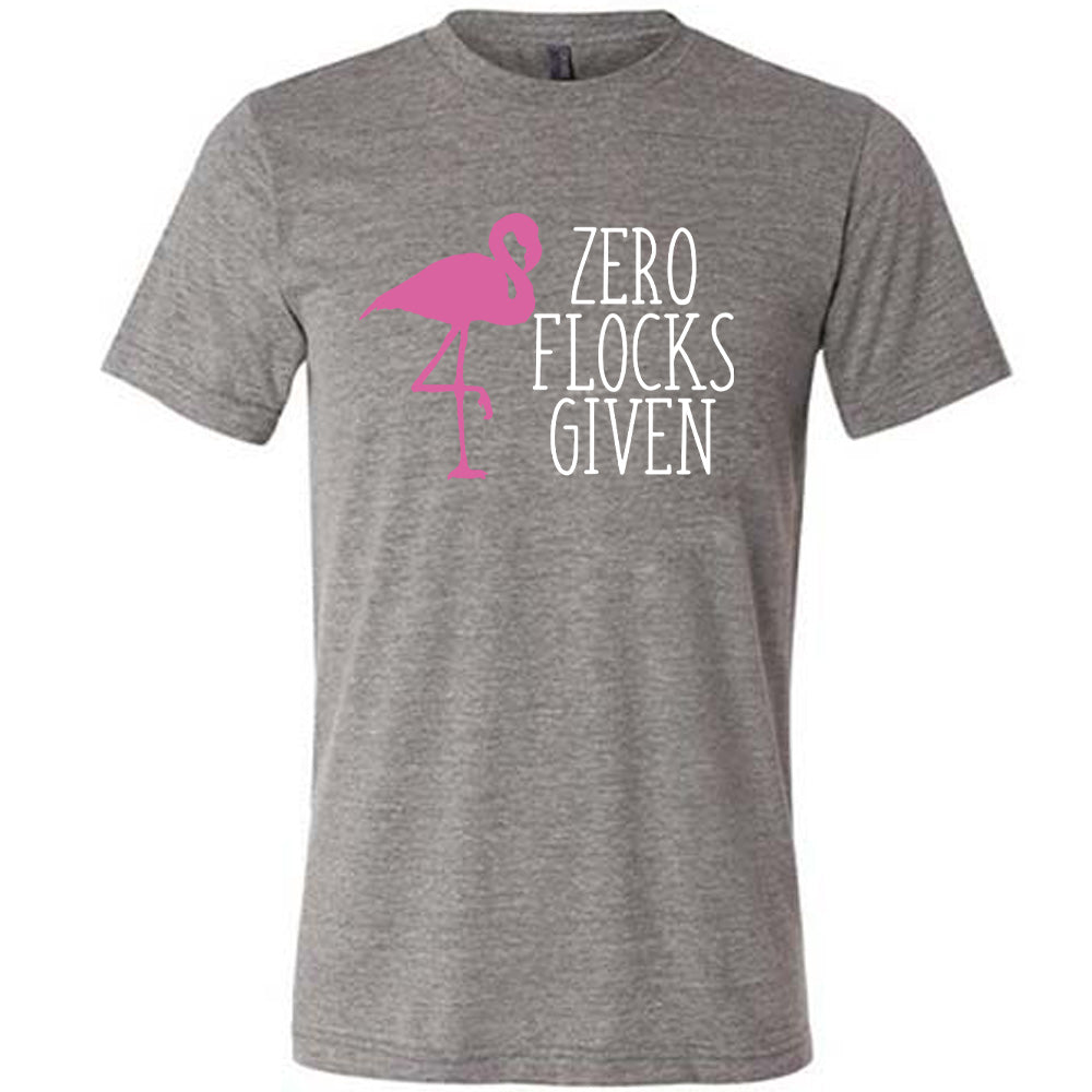 grey unisex tee with the words "zero flocks given" on it, with the pink silhouette of a flamingo, leg raised, next to the words