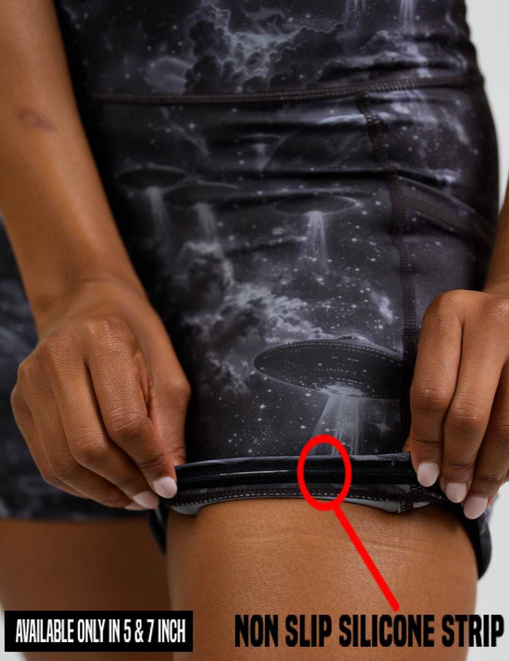 close up of the alien space ship invasion shorts being rolled up to show the non slip silicone strip found in the 5 and 7 inch inseam length shorts