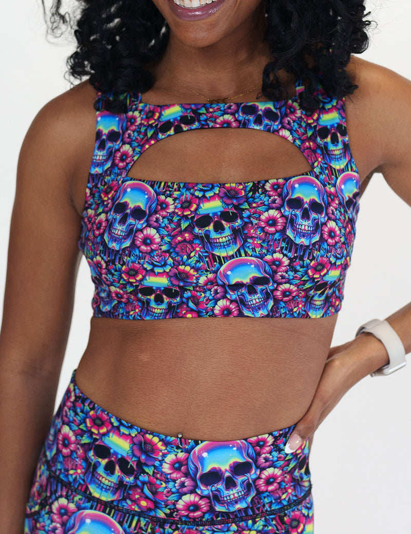 neon skull print sports bra against a white background