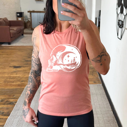 peach muscle tank top with an alien skull design