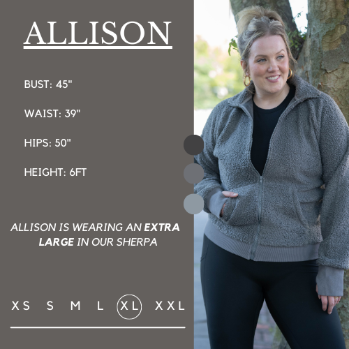 Model's measurements of 45 inch bust, 39 inch waist, 50 inch hips, and height of 6 foot. She is wearing a size extra large in the sherpa