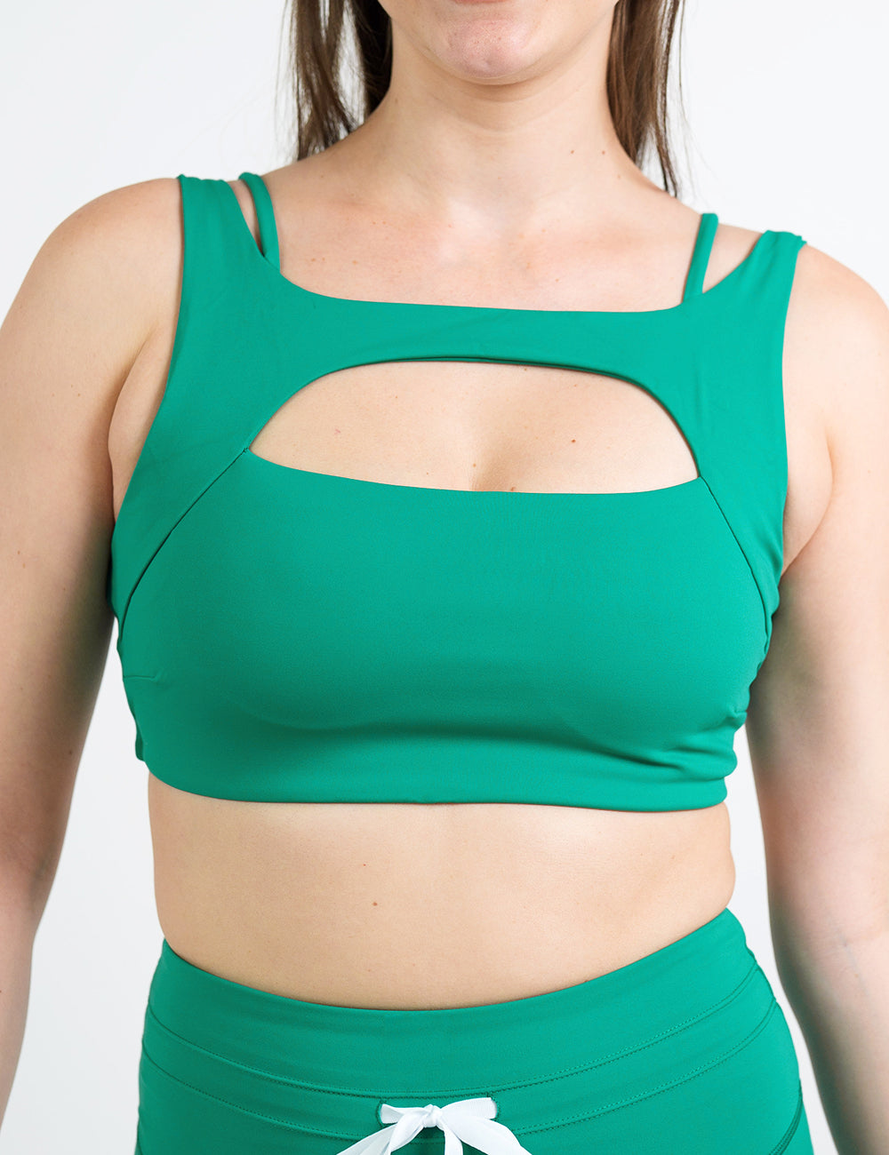 front of the green vista bra against a white background