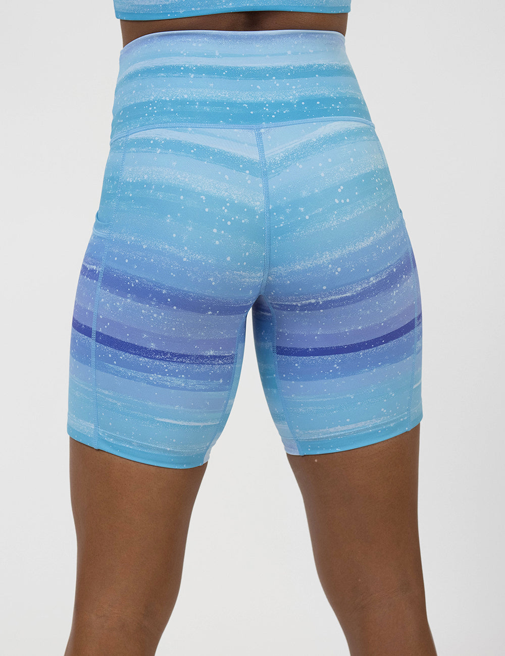 back of the 7 inch blue and white ombre shorts against a white background