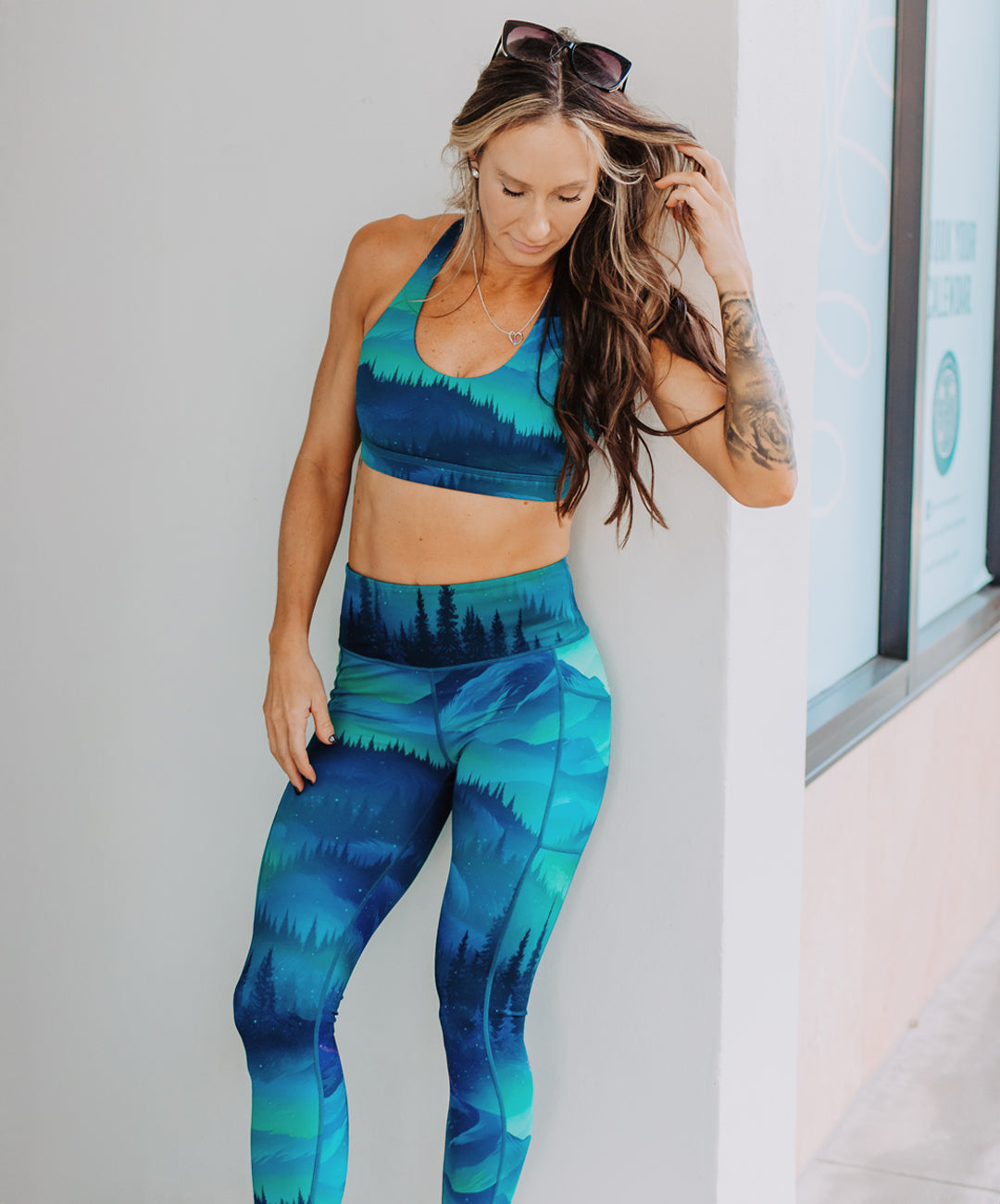 model wearing aurora borealis leggings