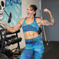 model in the gym flexing wearing aurora leggings and bra