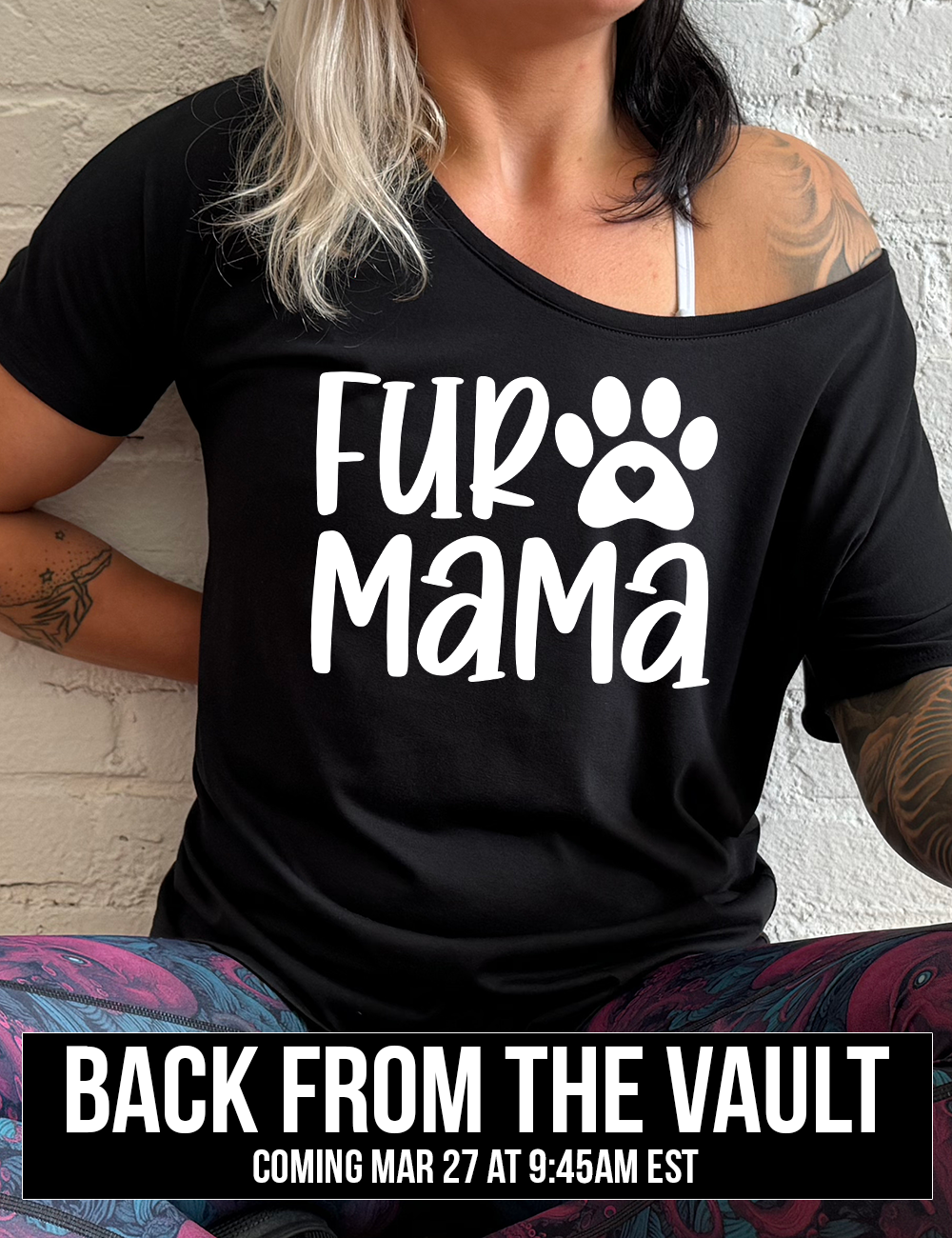 black slouchy tee with the words "fur mama" on it and a pawprint graphic with a little heart at the center of it, coming soon