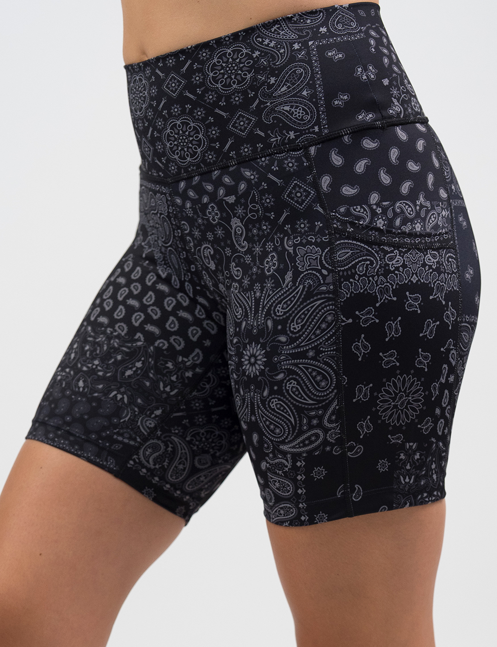 front of the black 7 inch shorts with a white paisley pattern against a white background