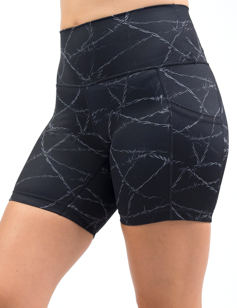 front of the 5 inch black shorts with a white barbed wire pattern on it against a white background