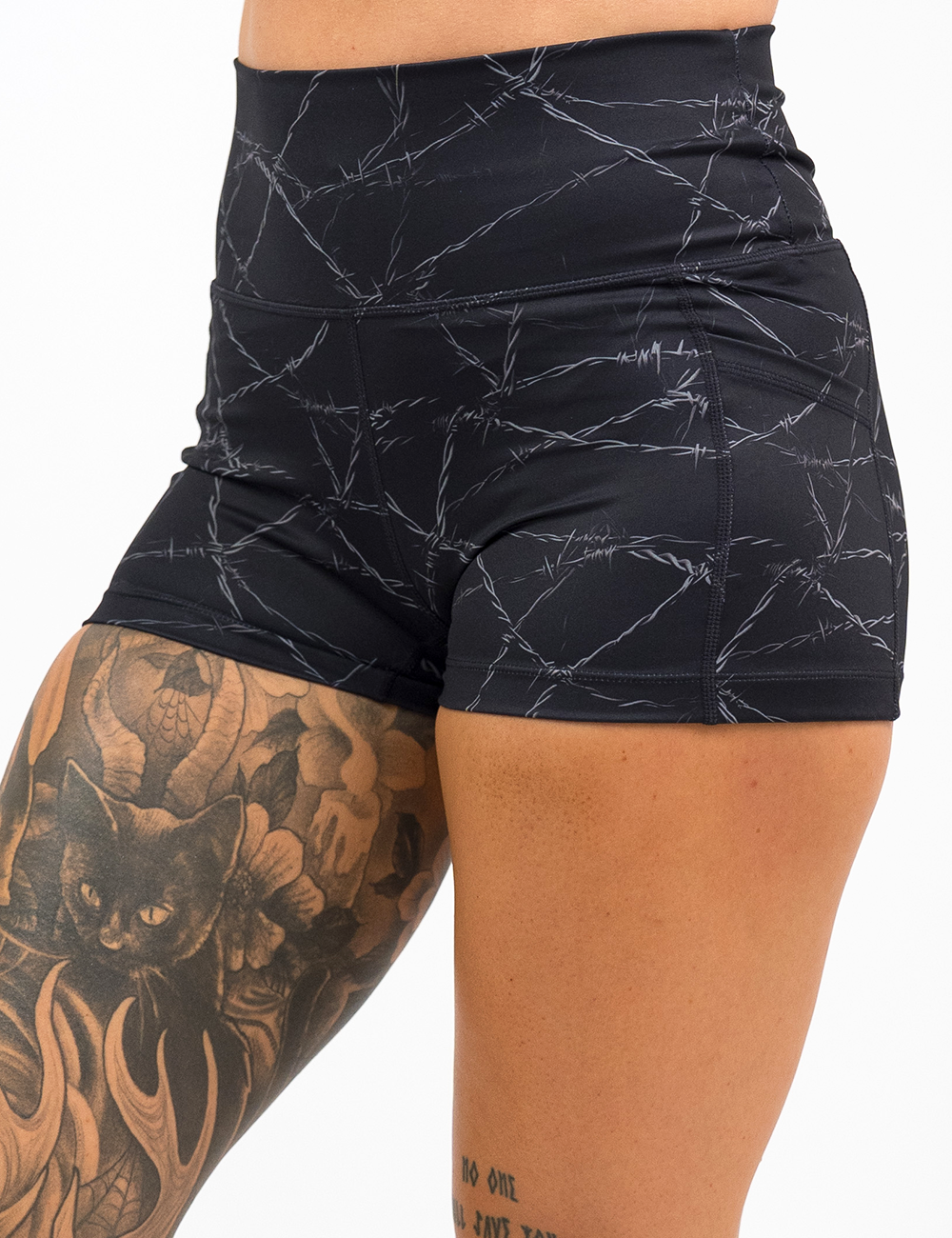 black shorts with a white barbed wire pattern on it