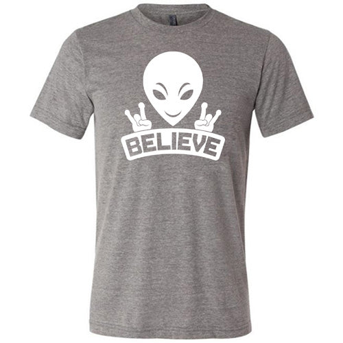 grey unisex shirt that has an alien design on it that says "believe"