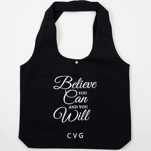 "Believe you can and you will" saying on a black tote bag