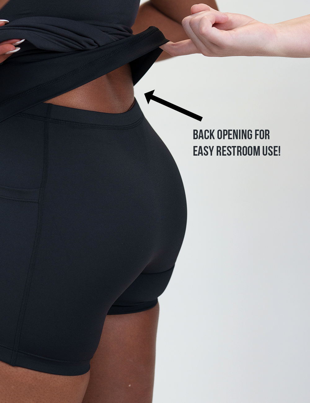 back of the half zip dress lifted up to show the easy restroom use back opening