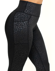 close up of black leopard leggings