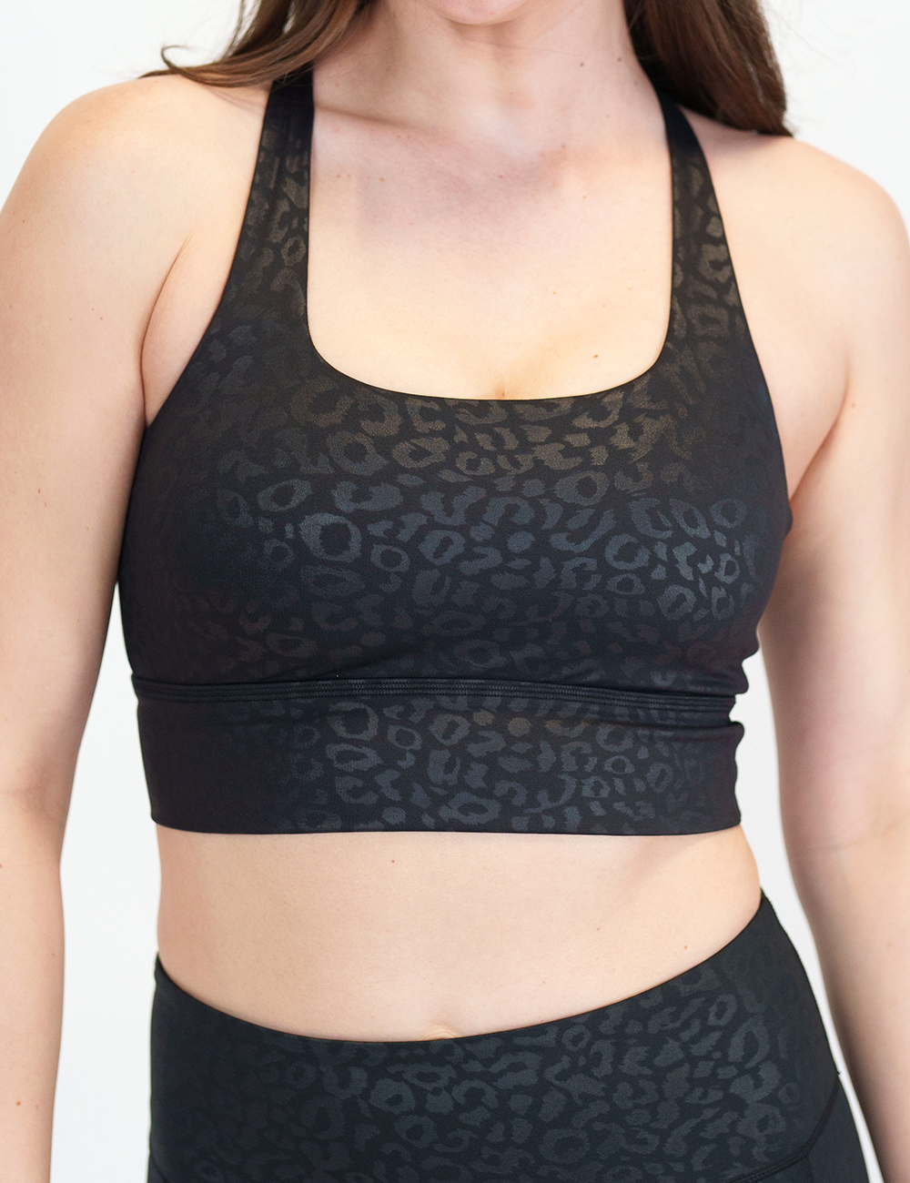 front of black leopard print longline bra against a white background