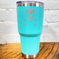 blue tumbler with skull and barbell crossbones design