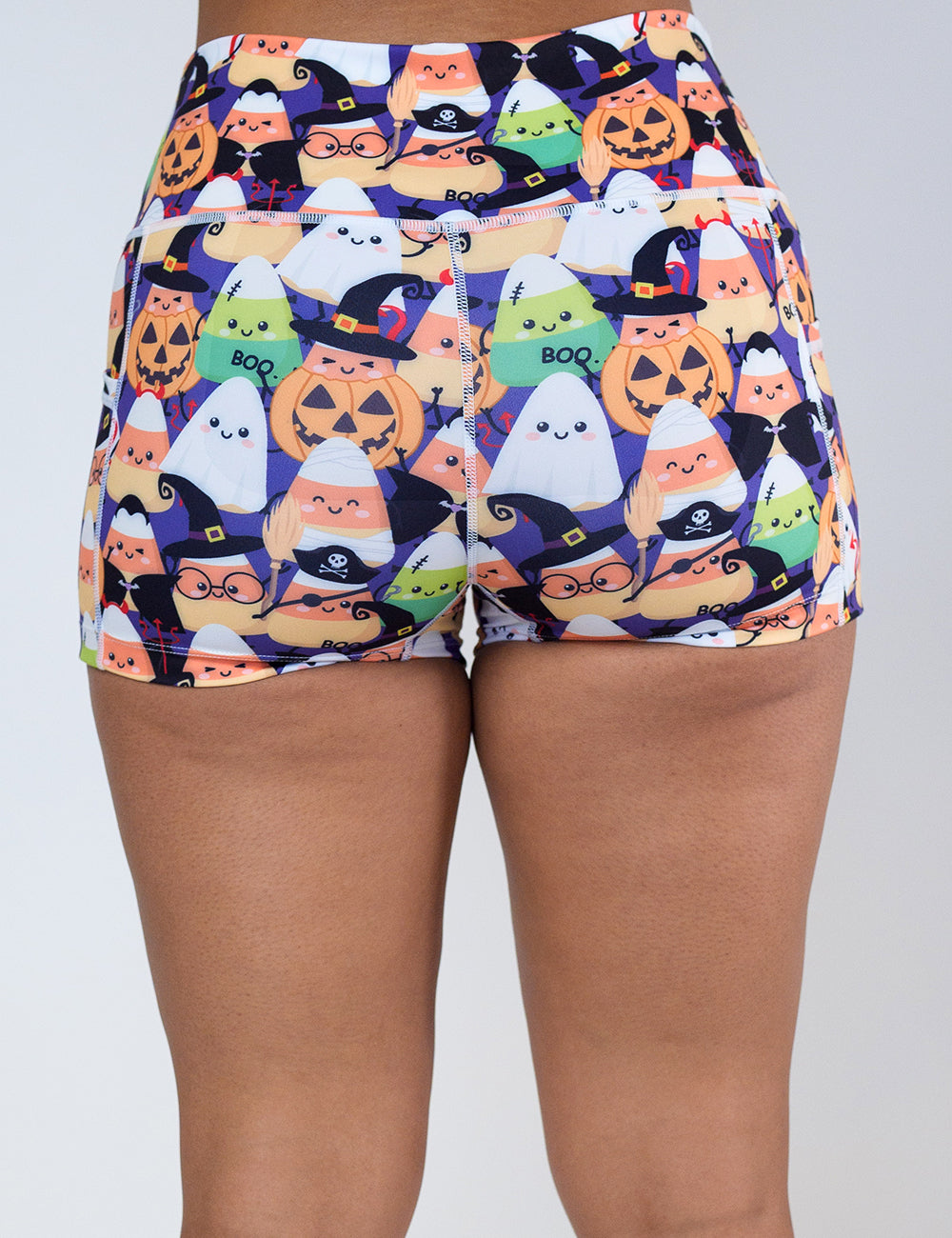 back of the 2.5 inch Halloween candy corn patterned shorts against a white background