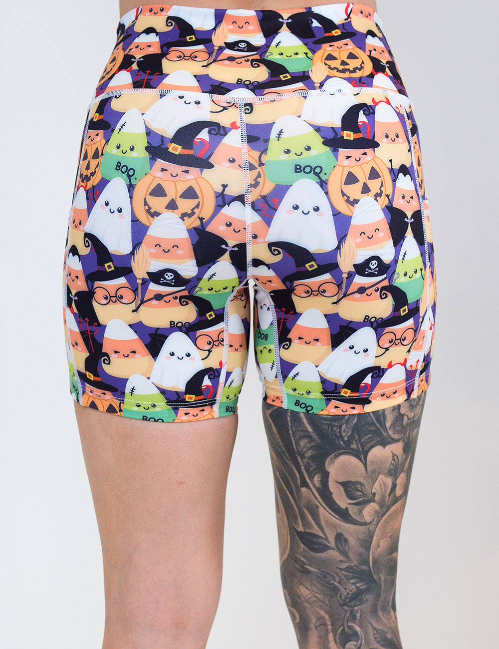 back of the 5 inch halloween candy corn patterned shorts against a white background