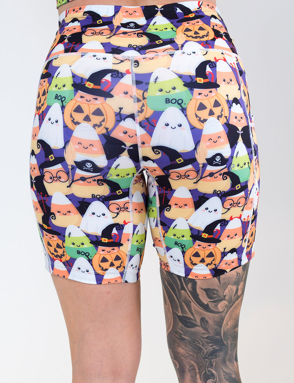 back of the 7 inch halloween candy corn patterned shorts against a white background