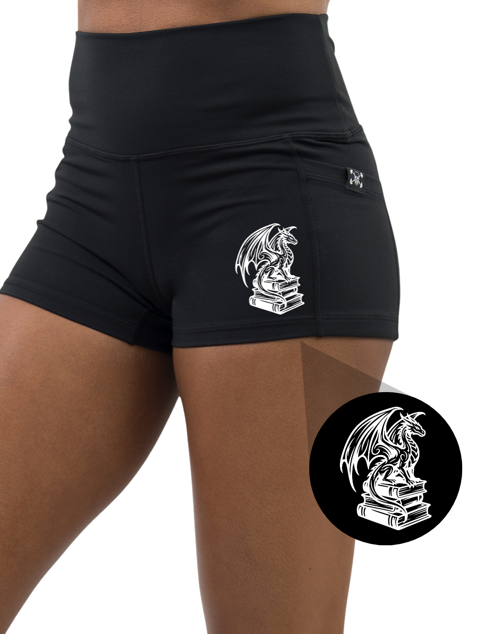 front of the dragon sitting on books graphic 2.5 inch black shorts against a white background