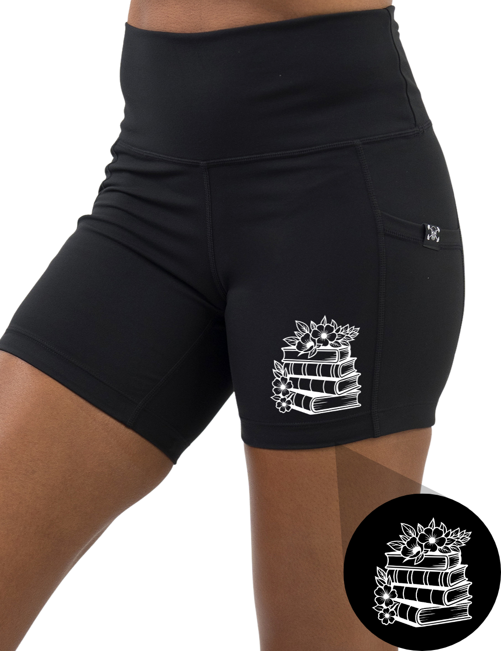 front of the books and flowers graphic 5 inch black shorts against a white background