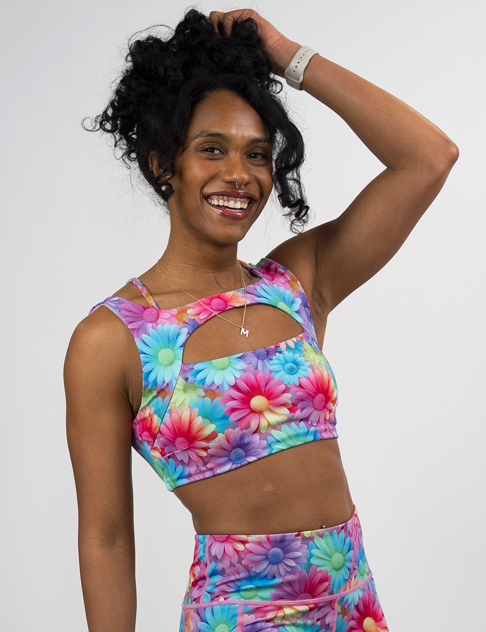 model wearing the pastel flower bra against a white background
