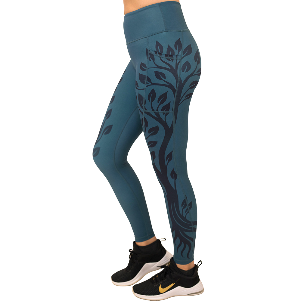 Teal leggings with black leaf pattern on a white background