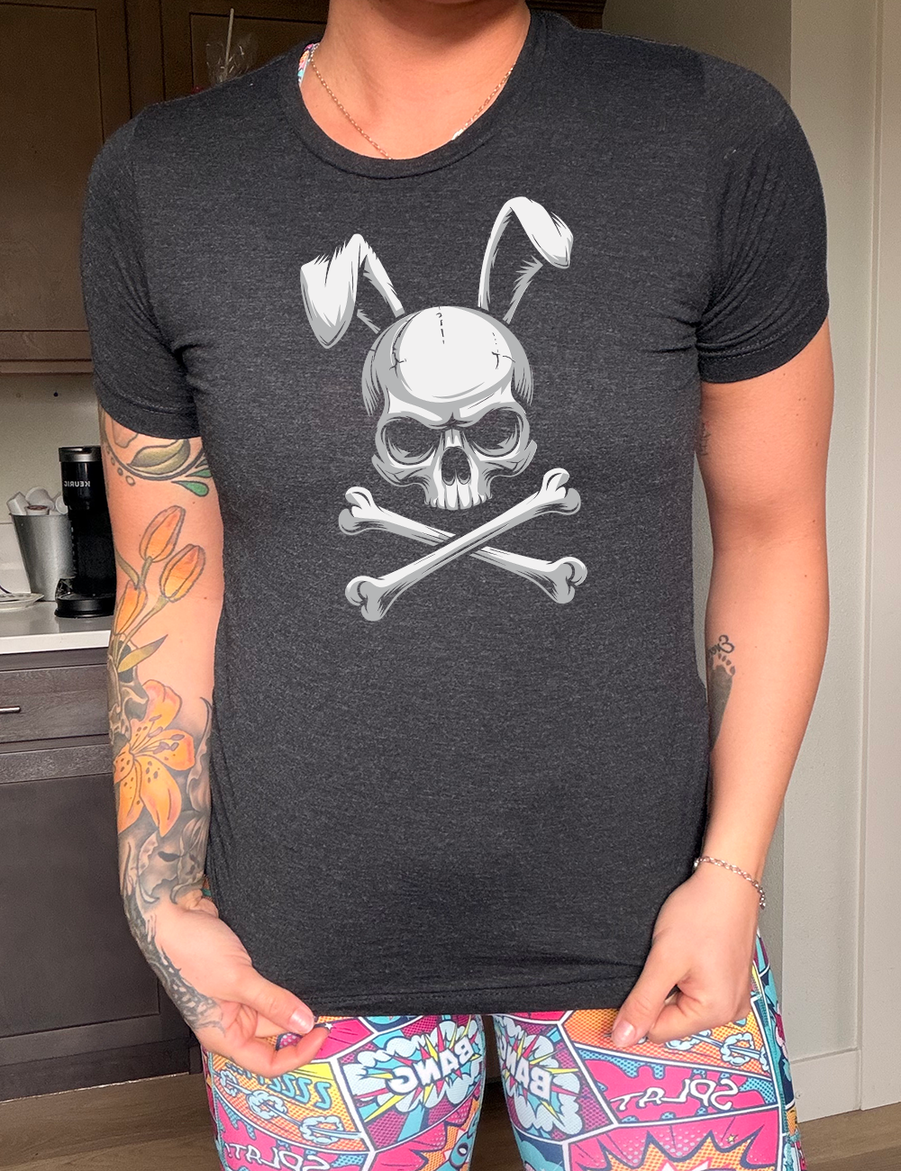black unisex tee with the large graphic of a skull and crossbones, and the skull has bunny ears 