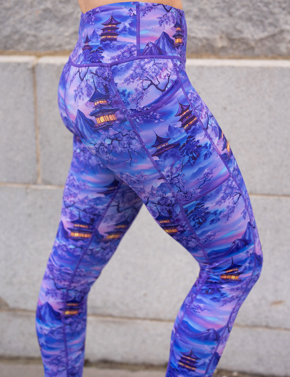 side view of the  lavender and blue floral full length leggings featuring traditional pagodas and blooming cherry trees 