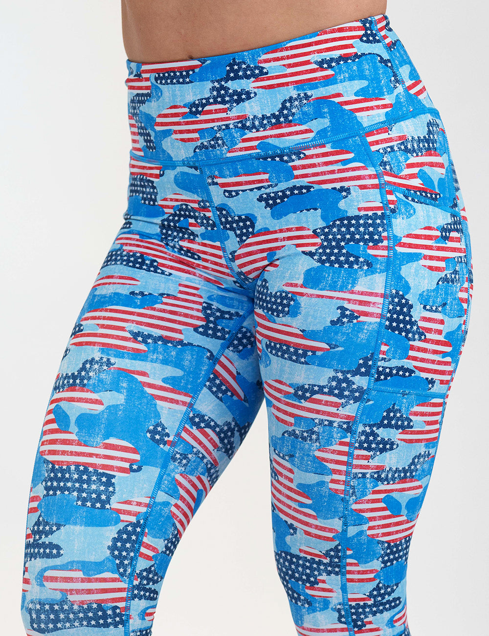 front of the camo flag print leggings against a white background