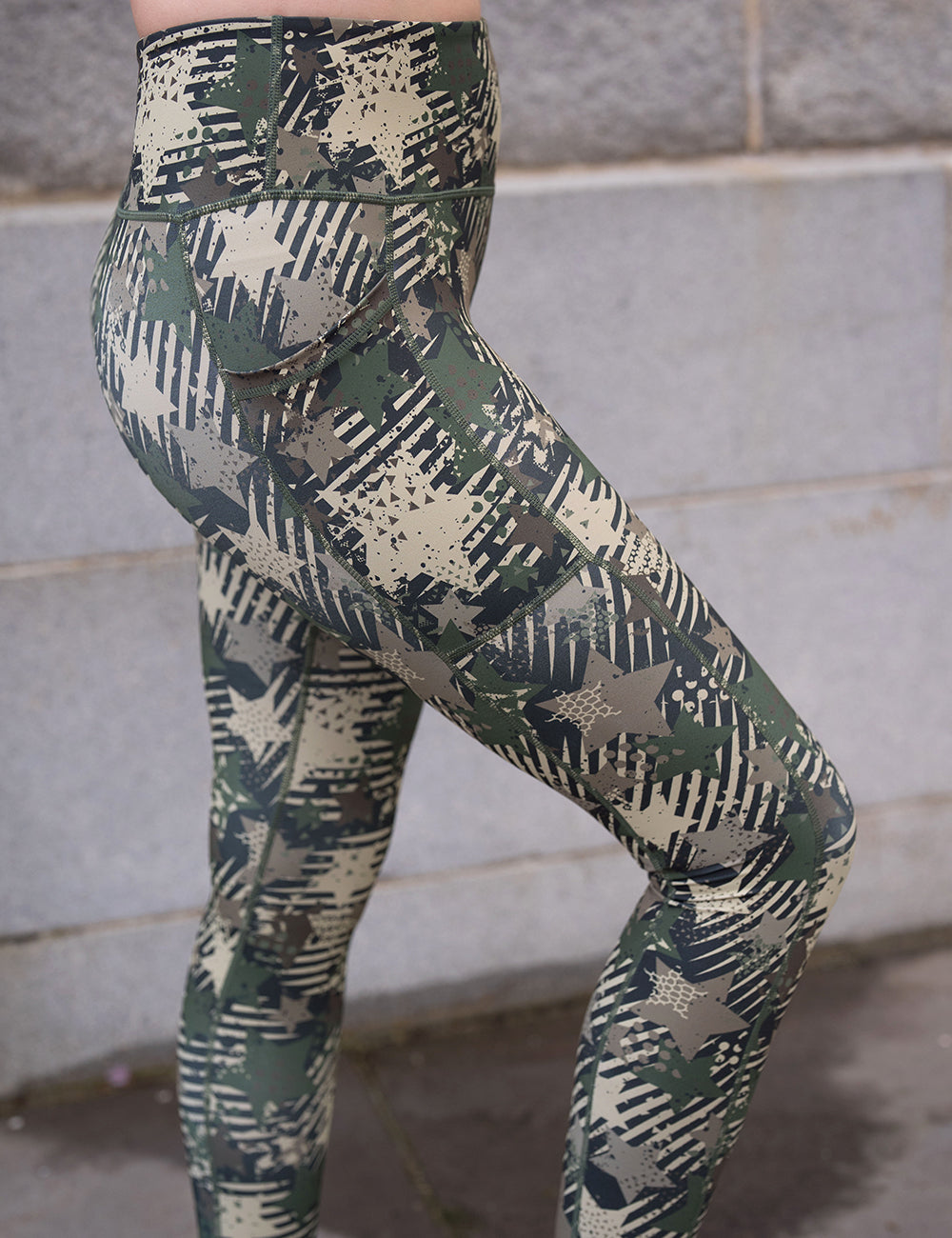 model wearing the green camo stars and stripes leggings