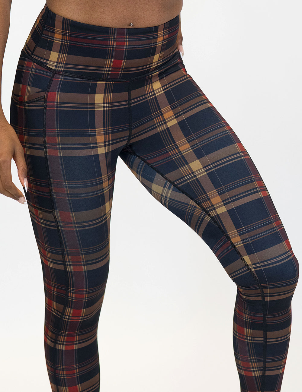 front of the red, black, and gold plaid leggings coming august 7th