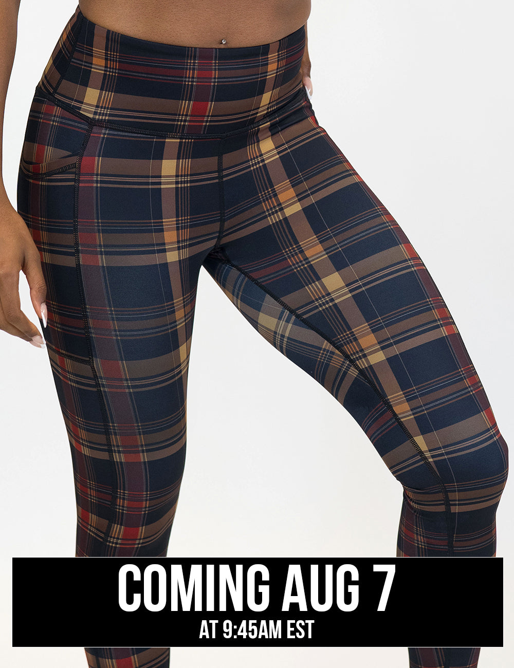 front of the red, black, and gold plaid leggings coming august 7th