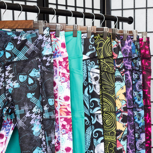 photo of different legging patterns hanging up on a clothing rack