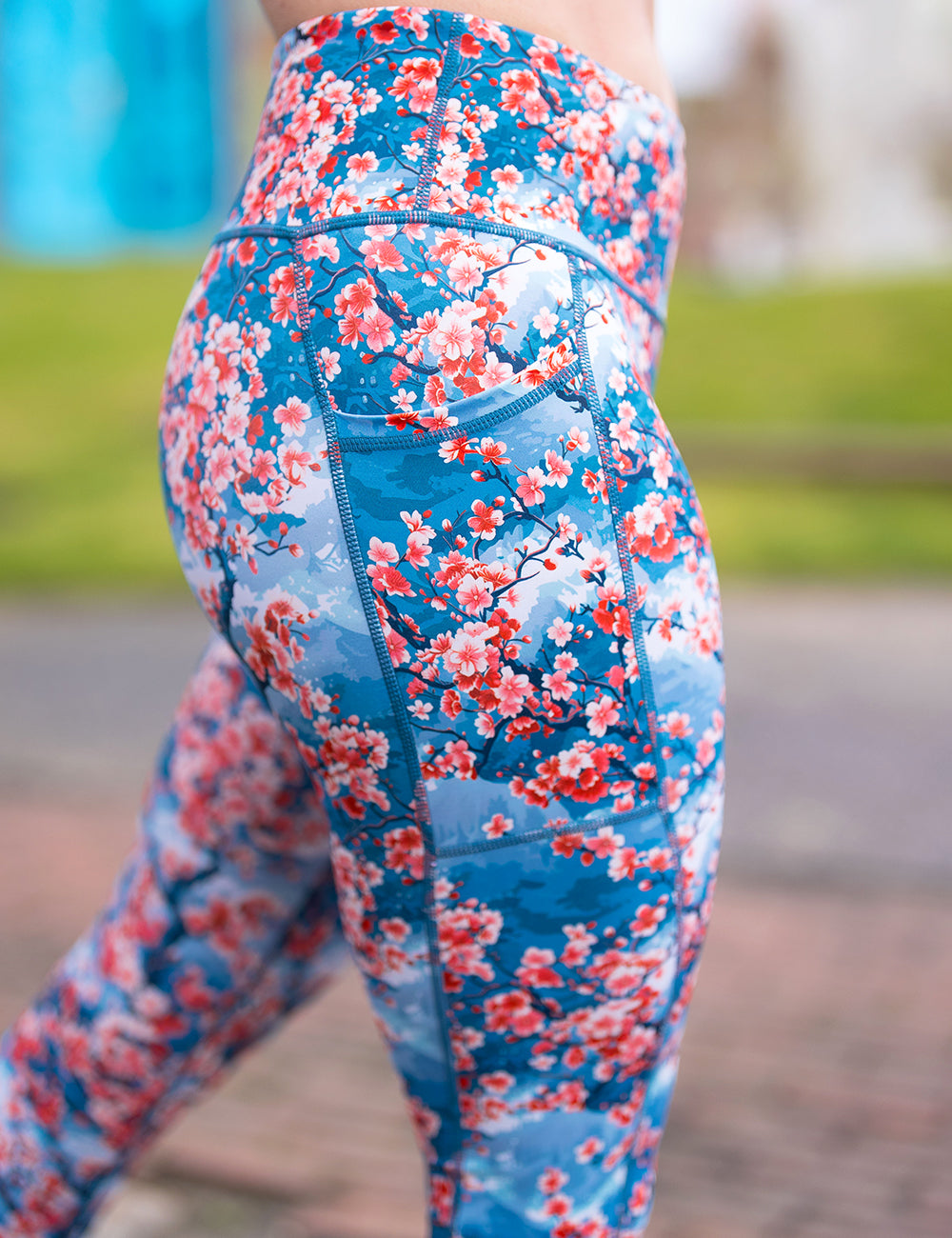 close up of a model wearing the blooming cherry tree blossom leggings