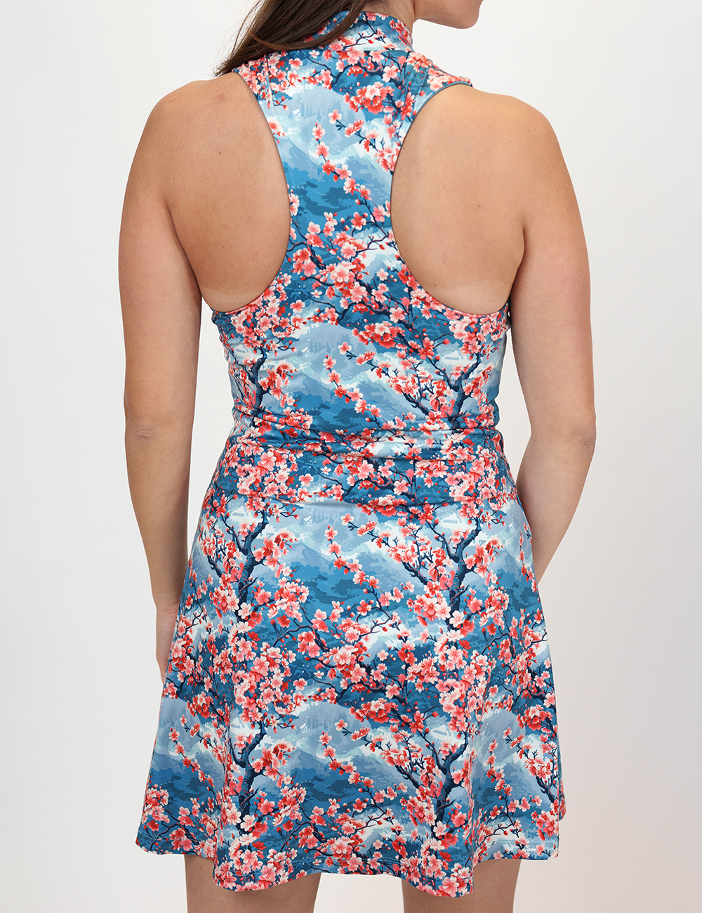 back of the cherry pattern dress against a white background