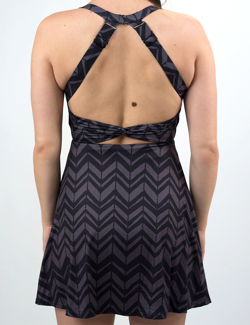 back of the grey arrows against a black background active dress against a white background