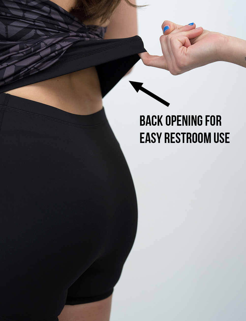 grey arrows against a black background active dress lifted up in the back to show the shorts lining under the dress