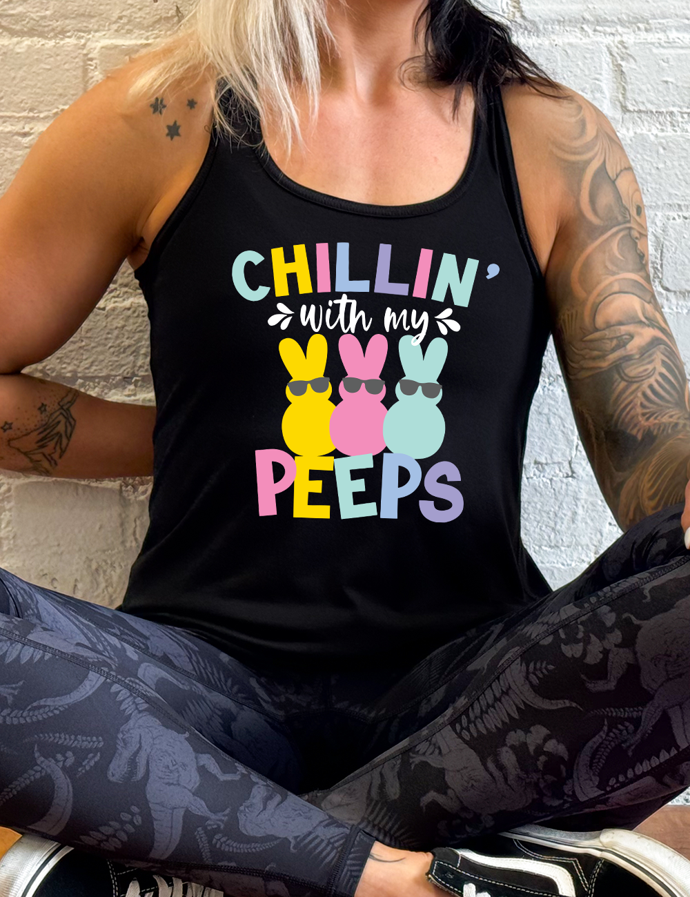 black racerback tank with the words "chillin' with my peeps" on it, with the graphic of three candy peeps wearing sunglasses