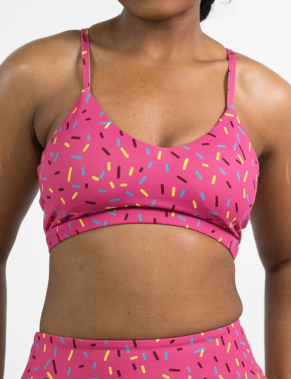 front of the pink move free bra with a sprinkles pattern against a white background