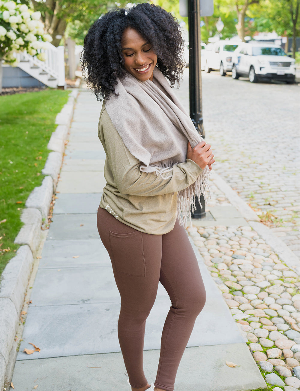 model wearing the solid brown fleece lined leggings