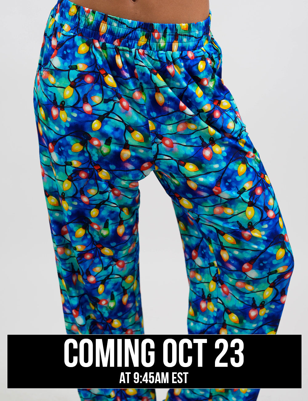 close up of the Christmas lights in front of  blue and teal background pajama bottoms, coming October 23