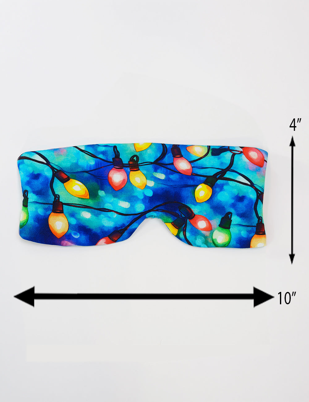 measurements for the Christmas lights in front of  blue and teal background eye mask, measurements are 4 inches by 10 inches