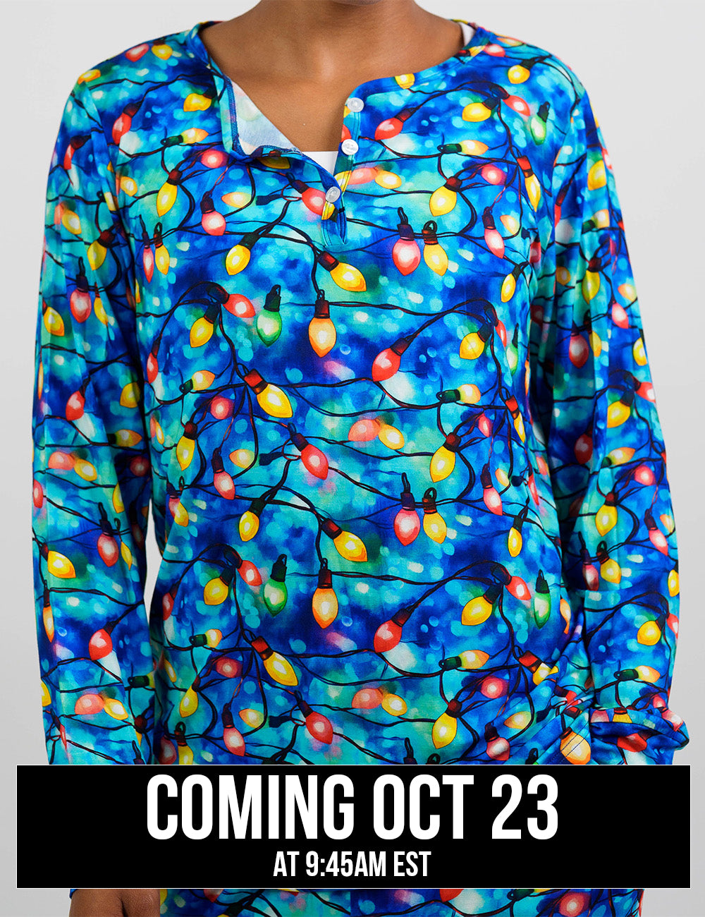 front of the Christmas lights in front of blue and teal background pajama top, coming October 23