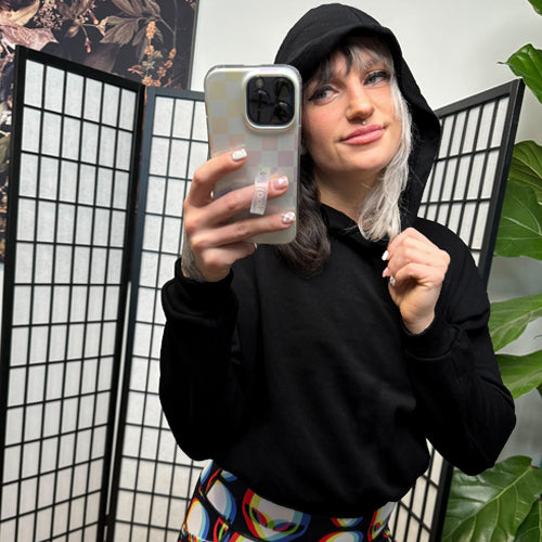 model wearing a cropped black hoodie