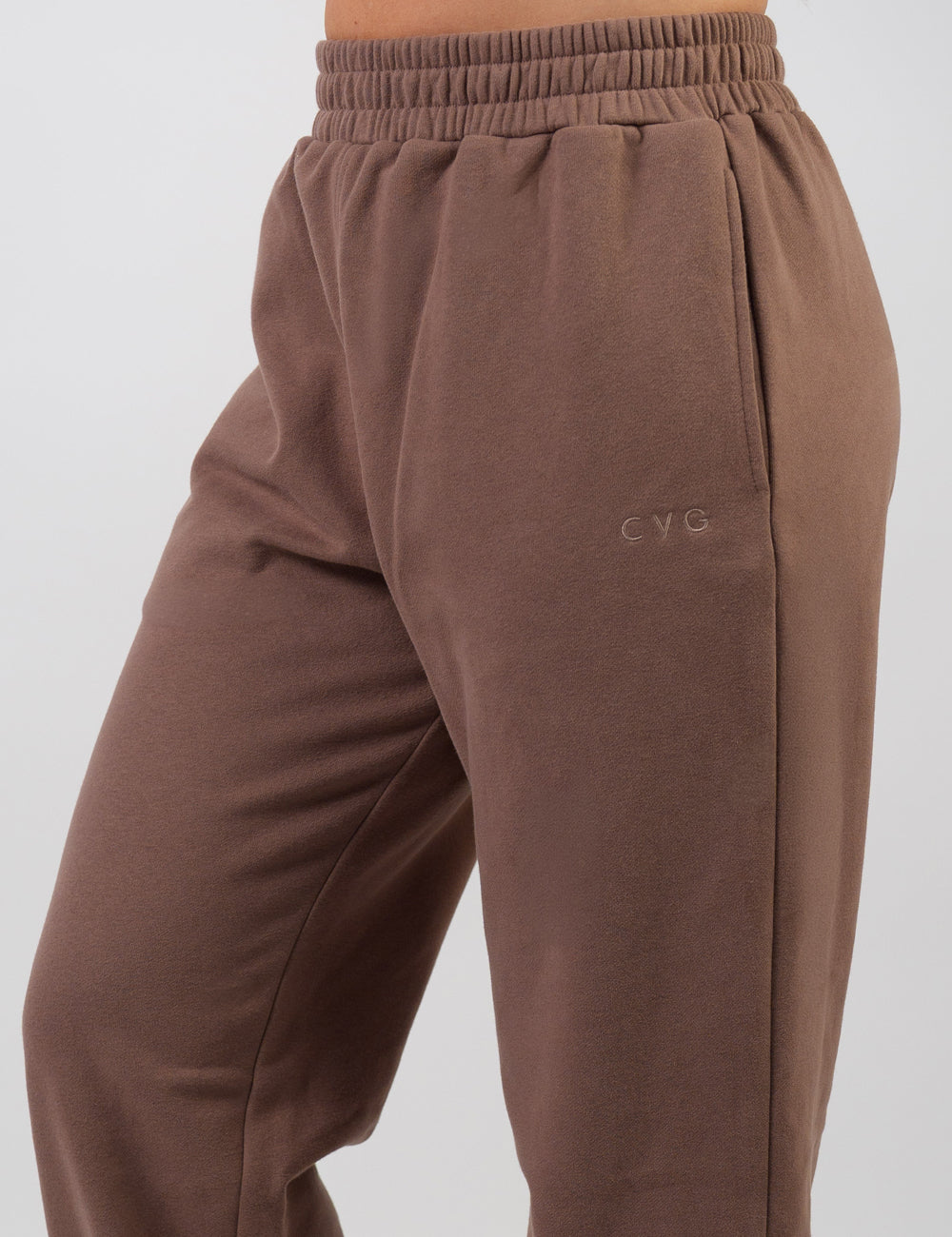 front of the brown sweatpants with a subtle CVG logo