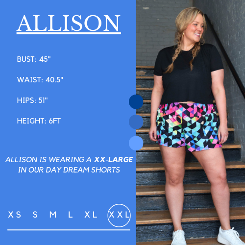 Model's measurements of 45 inch bust, 39 inch waist, 50 inch hips, and height of 6 foot. She is wearing a xxl in the shorts